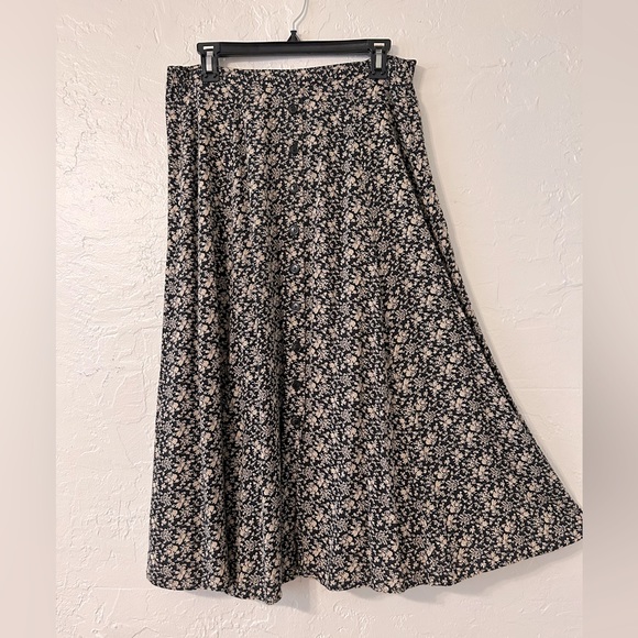 SOLD. Black Skirt, nude flower print. Flattering, nice fall to it. - Picture 1 of 7